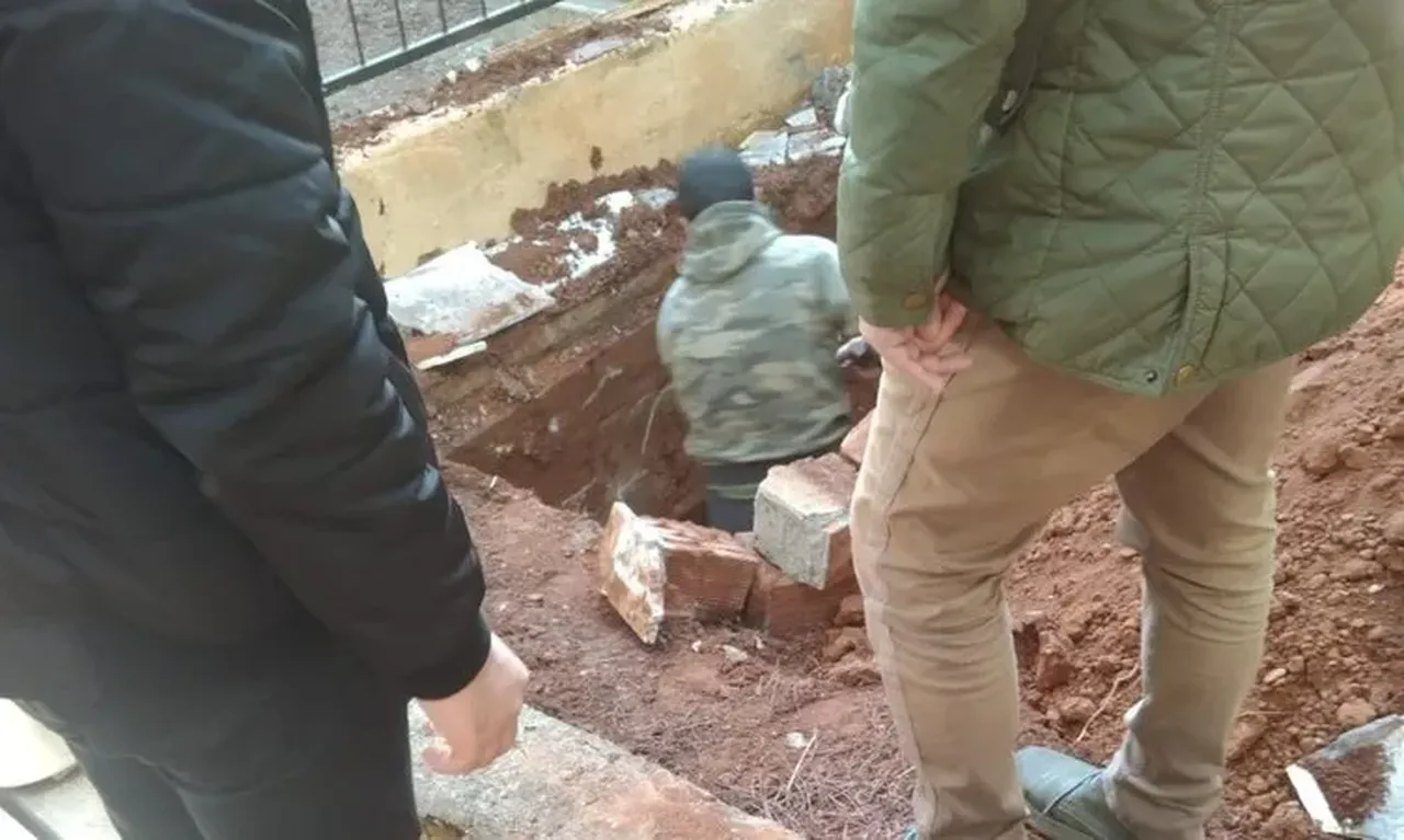 Workers and officials oversee the exhumation of Mustafa Uyanik's body to collect DNA samples in a legal case that exposed a 41-year-old secret, in Mugla, Türkiye, Feb. 17, 2025. (TGRT Photo)