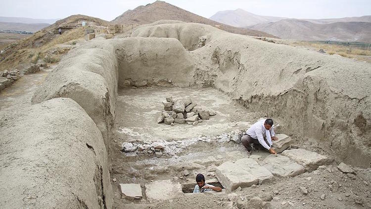 A third millennium B.C. sewage system discovered at Cavustepe in Van, Türkiye, with two archaeologists, one inside the system. (AA Photo)