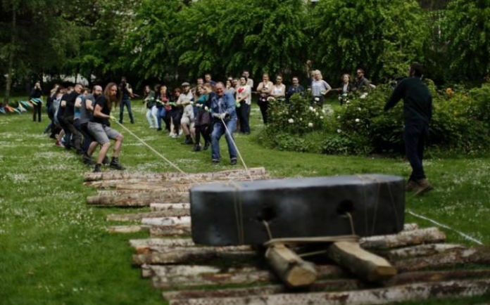 UCL students moving stones and testing out theories surrounding Stonehenge. (Photo via UCL)