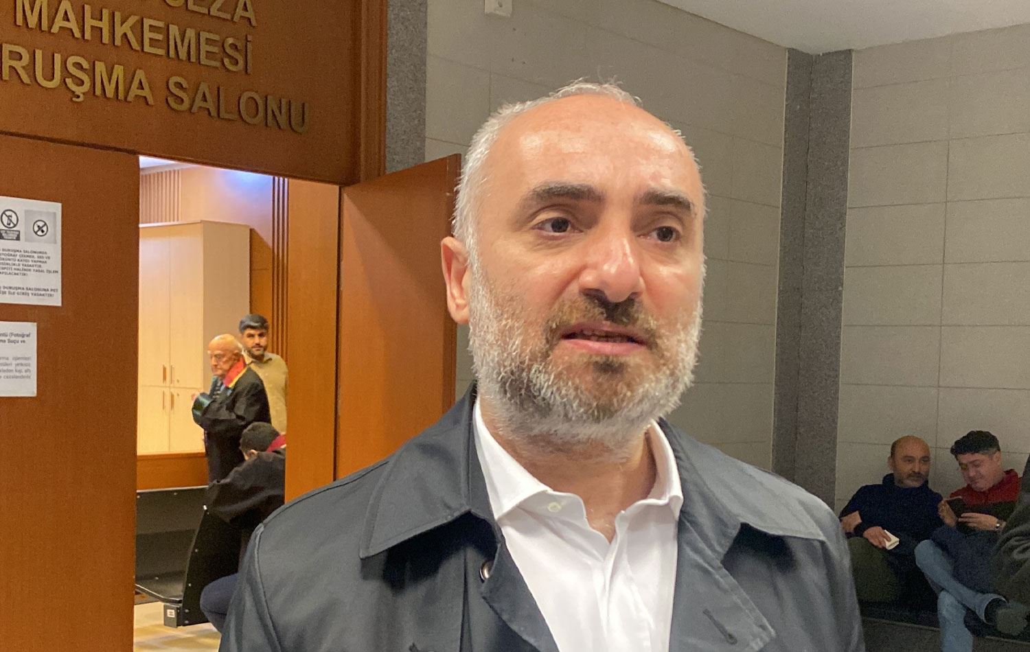 Turkish journalist Ismail Saymaz leaves the courtroom on Jan. 23, 2024. (Photo via Anka)