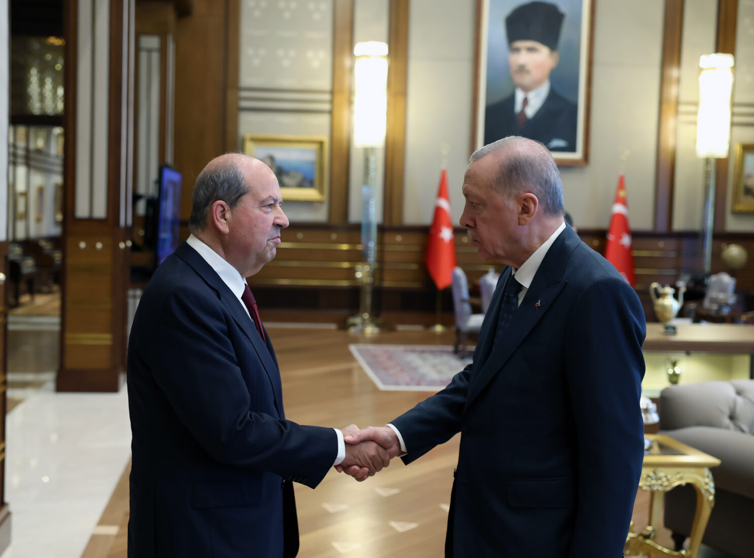 President Recep Tayyip Erdogan (R) shakes hands with Turkish Northern Cyprus (TRNC) President Ersin Tatar (L) at the Presidential Complex in Ankara, Turkiye on March 12, 2024. (AA Photo)