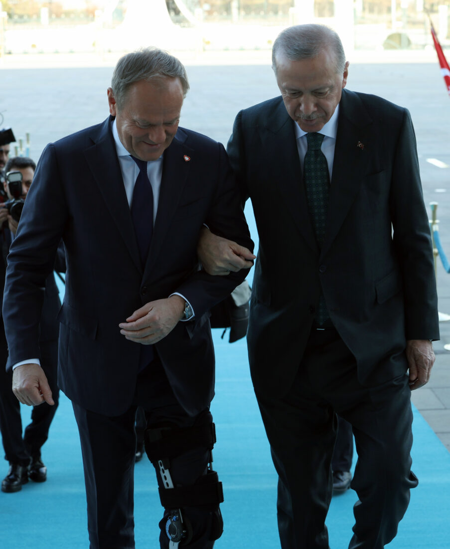 President Recep Tayyip Erdogan (R) assists Polish Prime Minister Donald Tusk (L), who had a foot injury, while he was climbing the stairs during the reception at Presidential Complex in Ankara, Türkiye on March 12, 2025. (AA Photo)