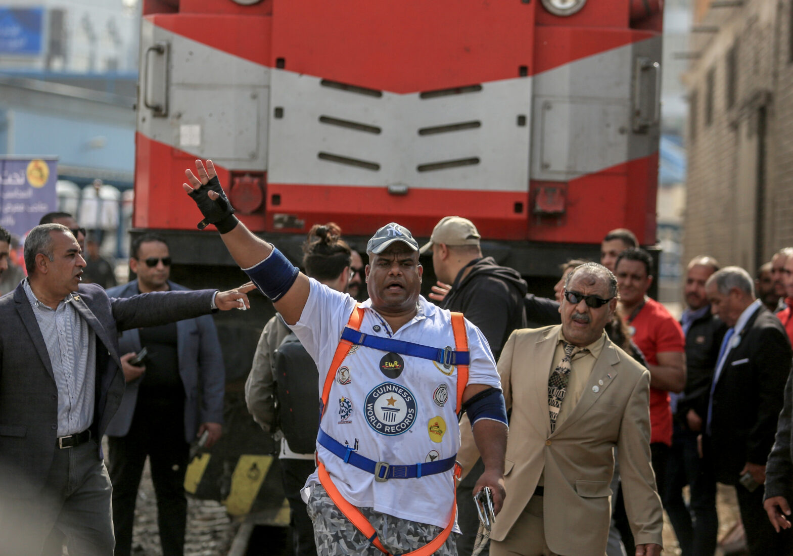 Egyptian wrestler Ashraf Mahrous, known as Kabonga, pulls a passenger train by 10 meters to enter the Guinness Book of World Records at Ramses station in Cairo, Egypt on March 13, 2025. (AA Photo)