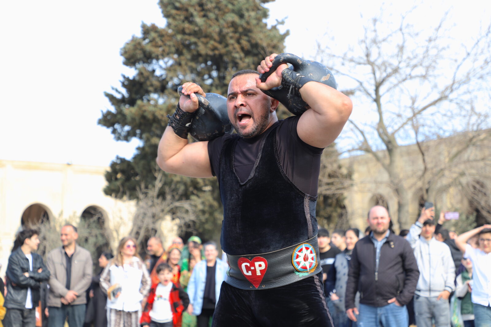 A man lifts a heavy object during the Nowruz celebrations held at Fire Temple of Baku in Surakhany district of Azerbaijani capital, March 18, 2025. (AA Photo)