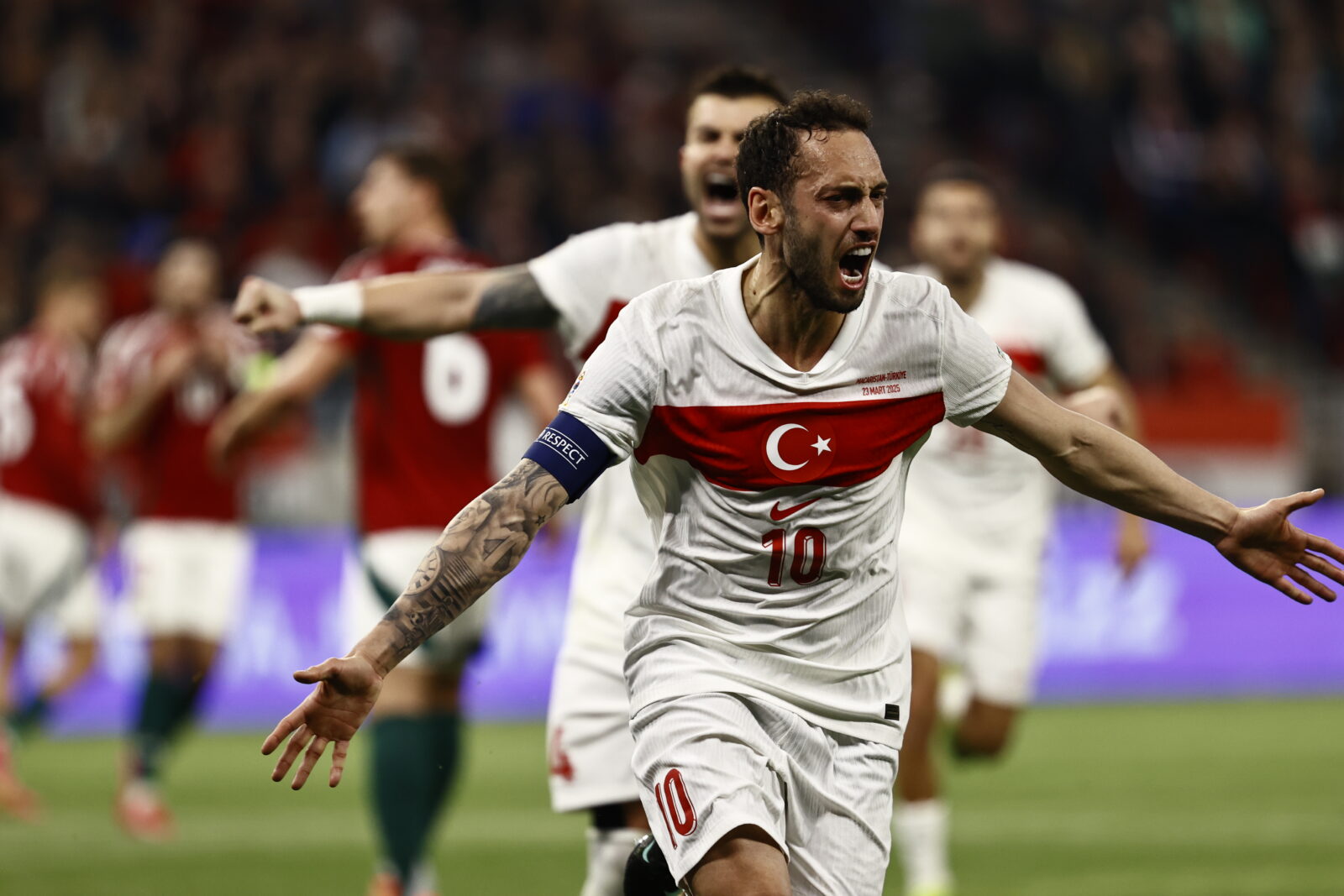 Hakan Calhanoglu (10) of Türkiye celebrates with teammates after scoring a goal during the UEFA Nations League A/B play-off second leg match between Hungary and Türkiye at Puskas Arena in Budapest, Hungary on March 23, 2025. (AA Photo)