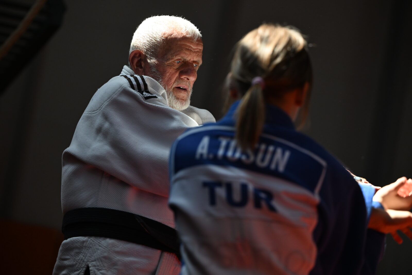 Suleyman Tosun, a 77-year-old from Duzce, has been supporting his hopeful national judoka granddaughter, 17-year-old Aysenaz Tosun, from the stands for many years, now, he brings that support to the mat as they train together. (AA Photo)