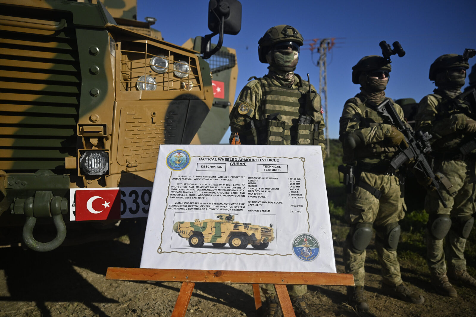 Turkish soldiers showcasing the BMC VURAN (4x4) armored vehicle at NATO's largest annual maritime drill, Exercise Dynamic Mariner / Flotex 25, continue in the Gulf of Cadiz off southern Spain on March 28, 2025 (AA Photo)