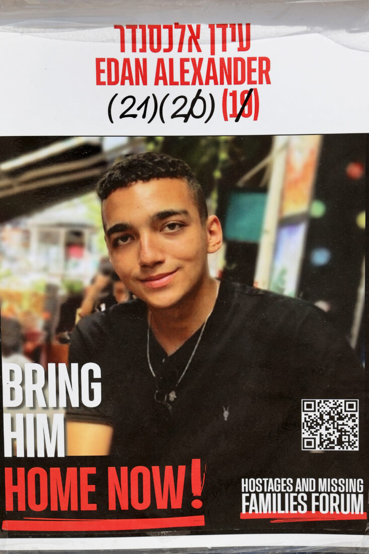 This photograph taken on Jan. 21, 2025, shows a poster bearing a portrait of Israeli-American hostage Edan Alexander (AFP Photo)