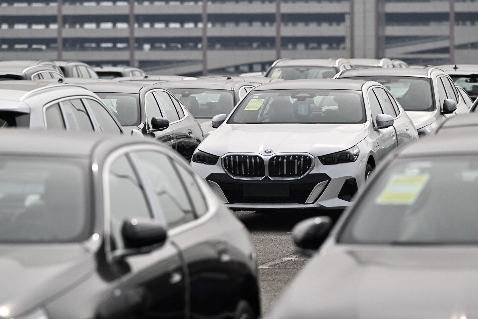 Auto giants Tesla, BMW warn of tariff fallout, predict heavy losses