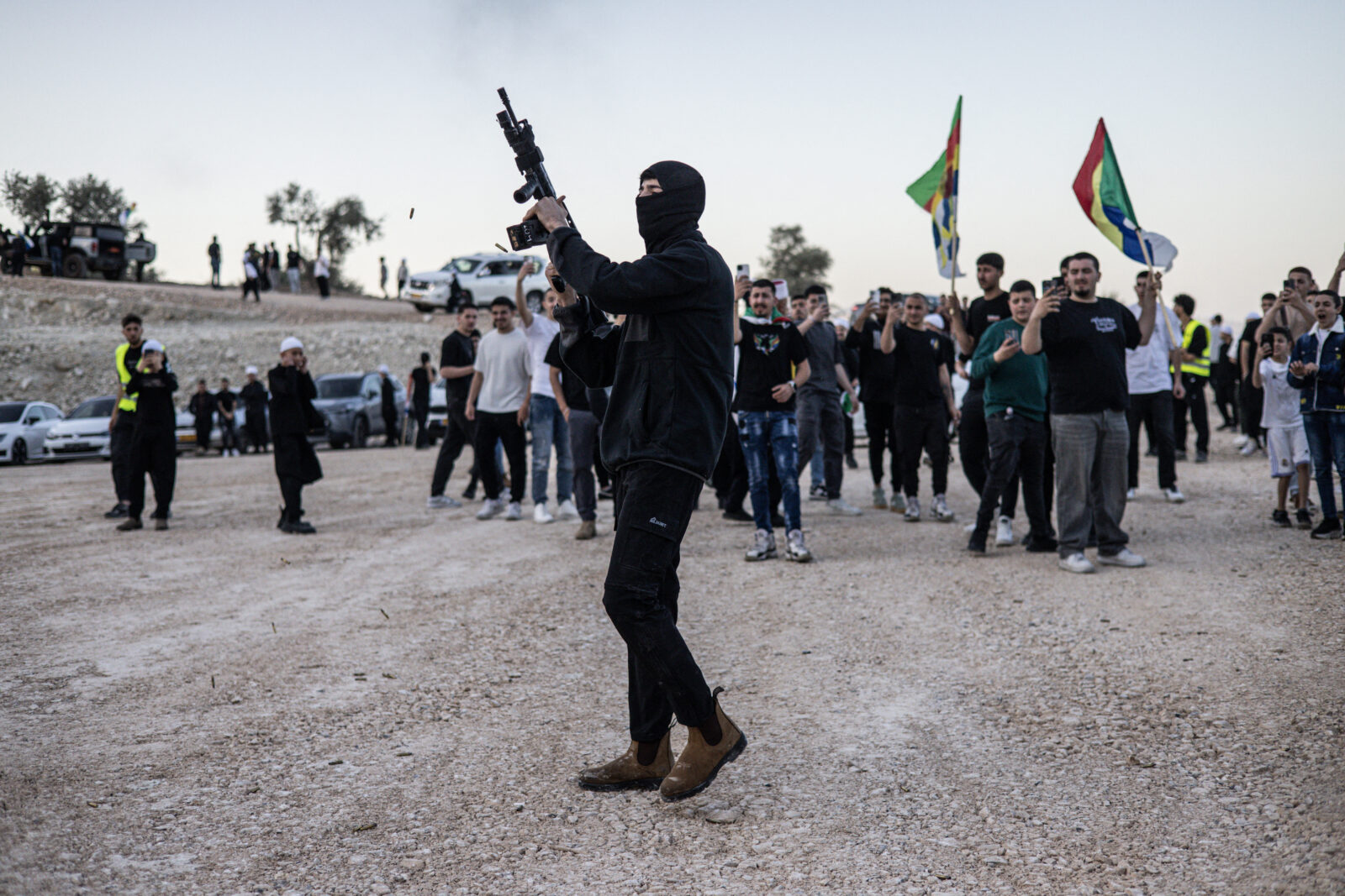 A man fires a weapon in the air ahead of the arrival of Syrian Druze clerics at the tomb of Nabi Shuaib in northern Israel on March 14, 2025 (AFP Photo)