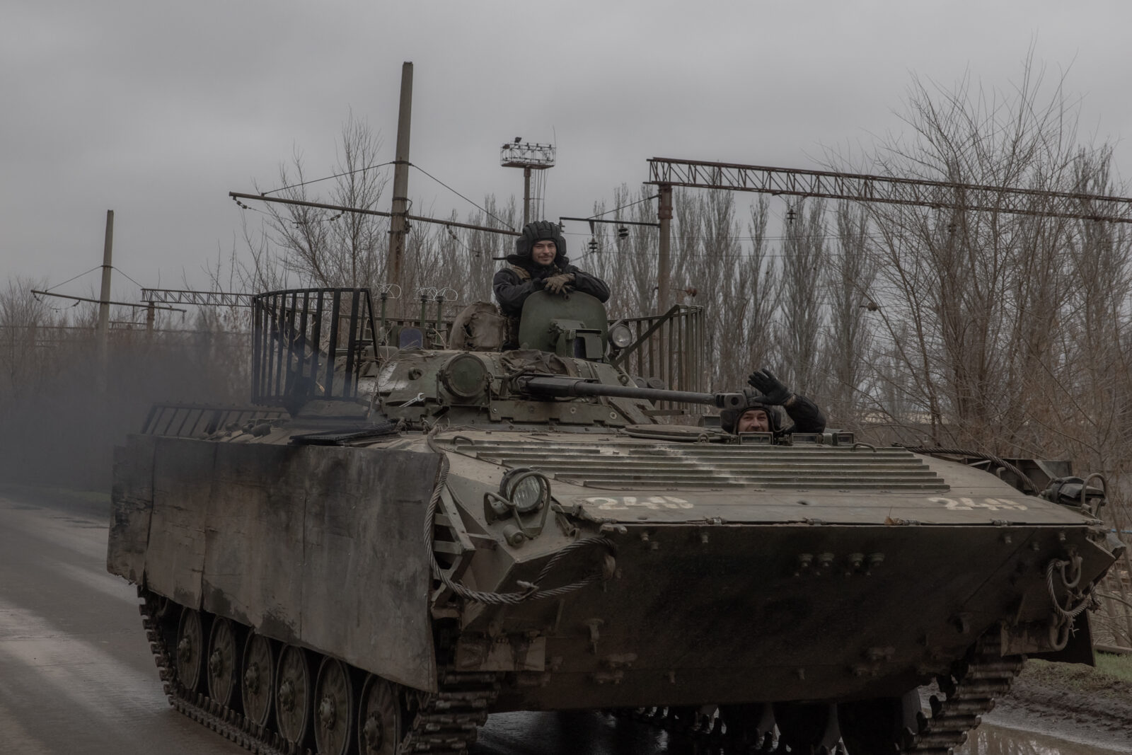 Ukrainian servicemen wave as they drive an armored vehicle on a road in the Donetsk region, March 17, 2025. (AFP Photo)