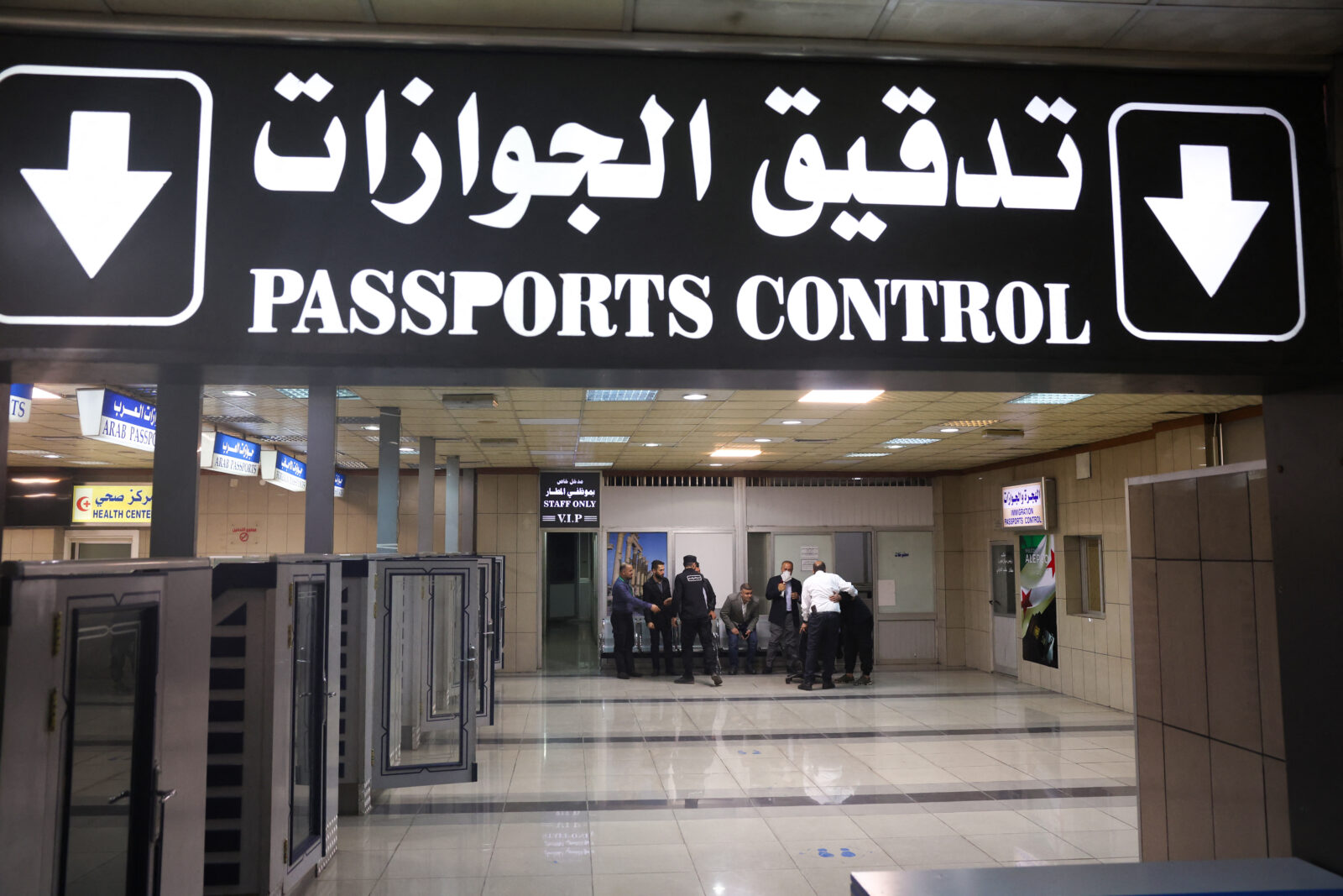 People wait at passport control at Aleppo airport, which was shut during the offensive that toppled President Bashar al-Assad, during its reopening on March 18, 2025. (AFP Photo)