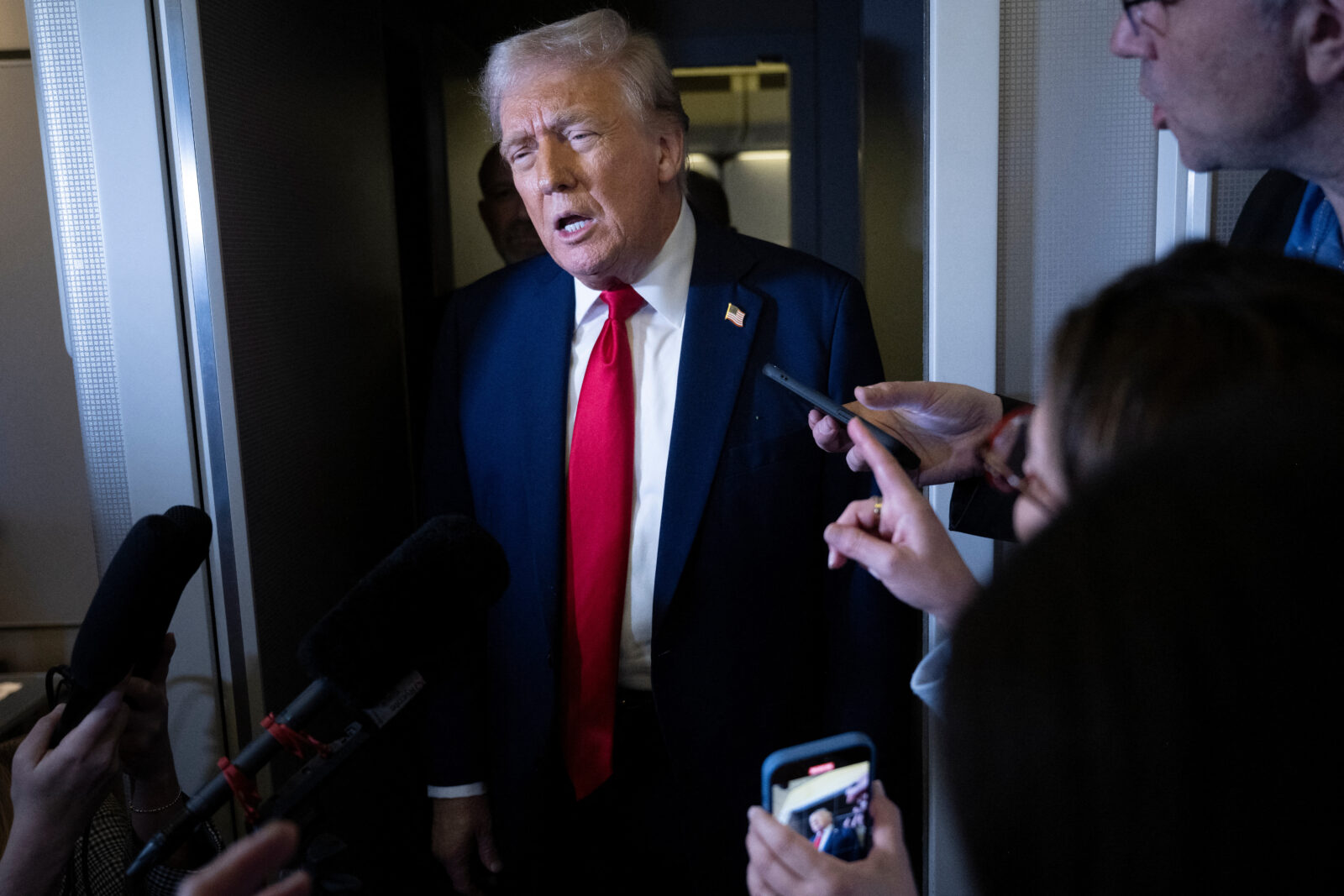 U.S. President Donald Trump speaks to members of the press while returning to Washington, D.C. on Air Force One in Fredericksburg, Virginia, on March 30, 2025. (AFP Photo)