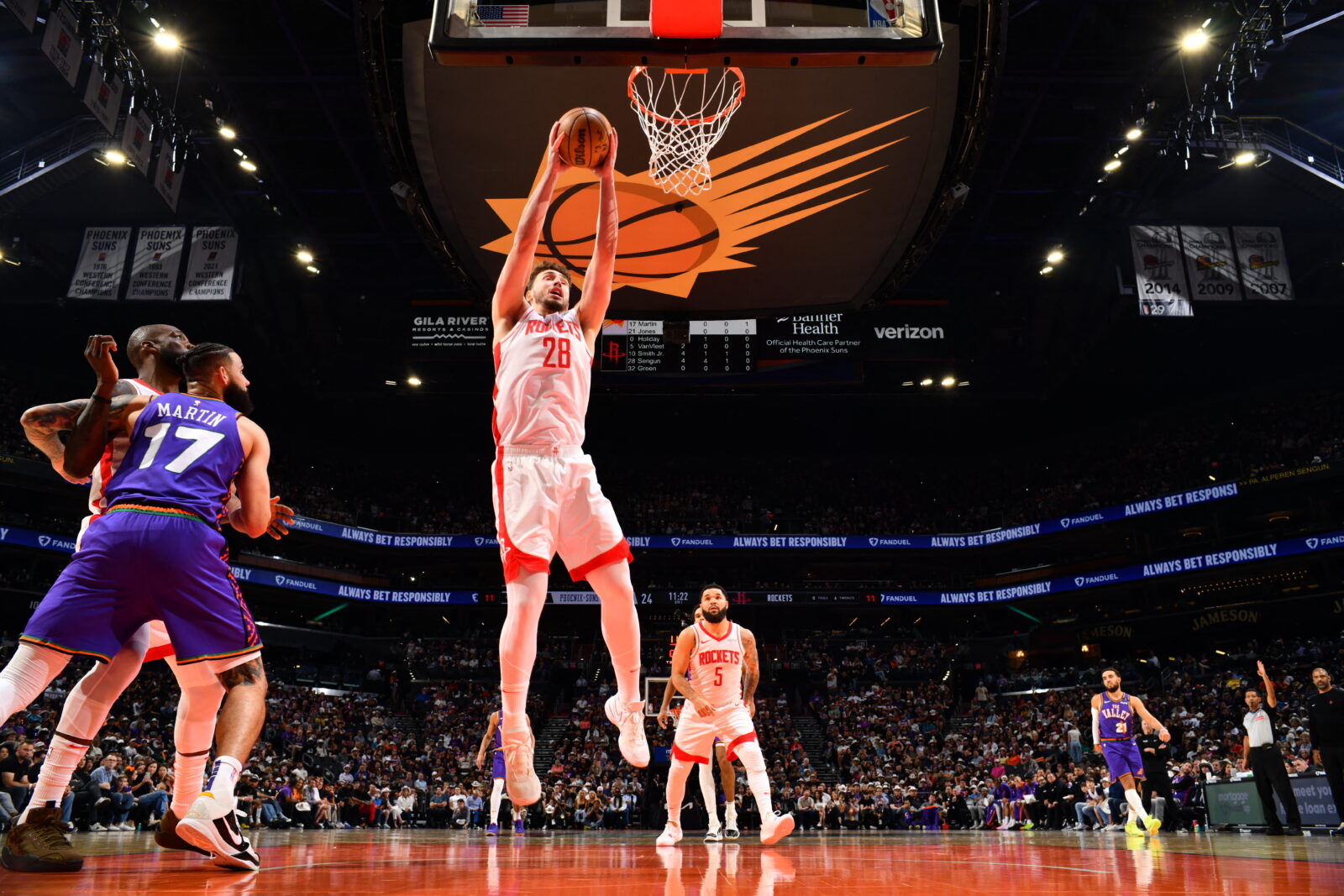 Alperen Sengun #28 of the Houston Rockets goes up for the rebound during the game against the Phoenix Suns on March 30, 2025, at PHX Arena in Phoenix, Arizona. (AFP Photo)