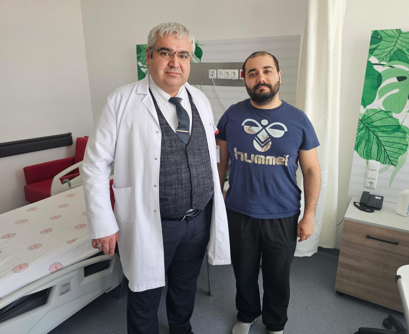 Turkish neurosurgeon Burak Yuruk poses with a colleague in Nigde, Türkiye, Mar. 5, 2025. (IHA Photo)