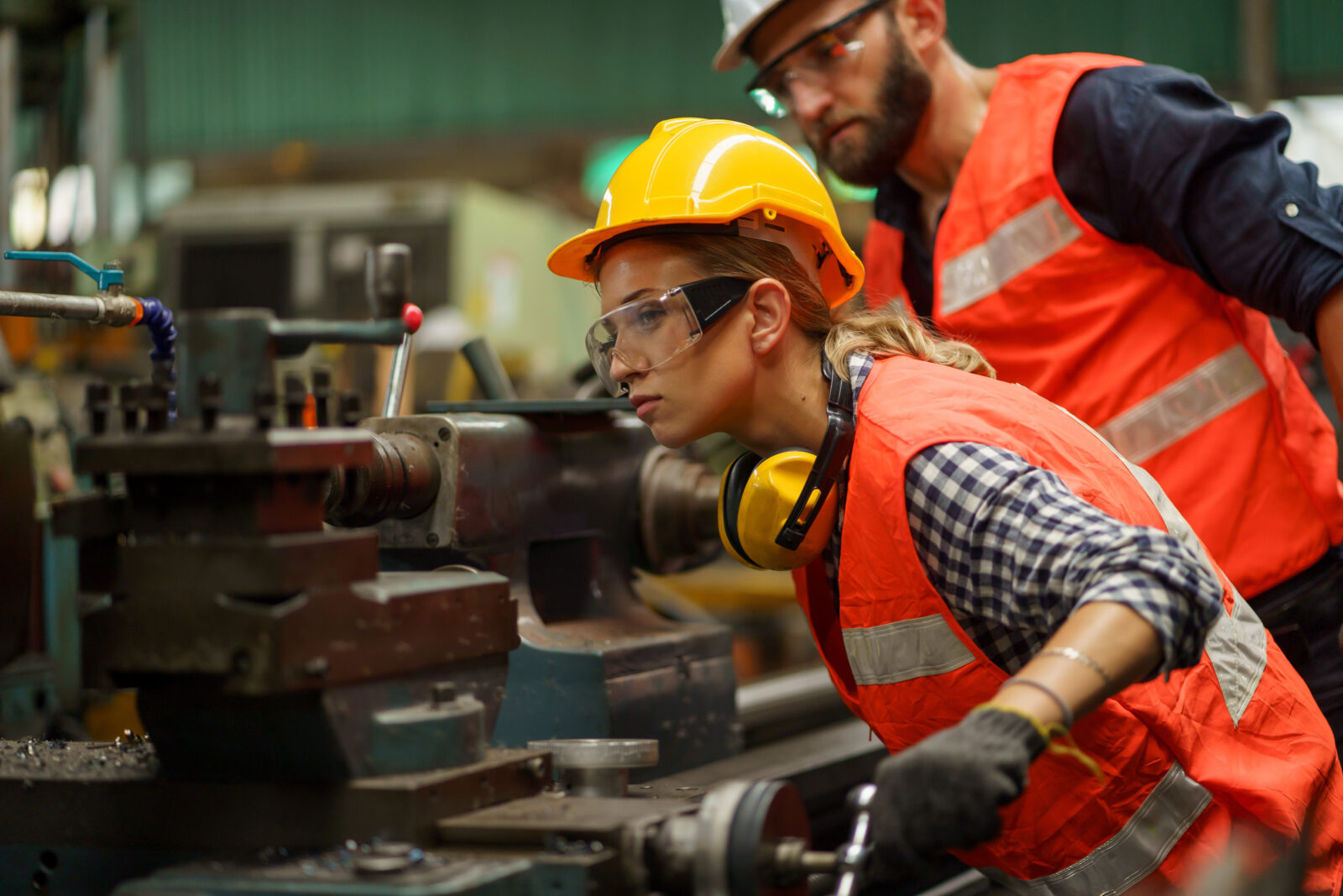 The file photo shows an engineer closely examining a lathe machine at a manufacturing facility in Germany, accessed on Mar. 23, 2025. (Adobe Stock Photo)