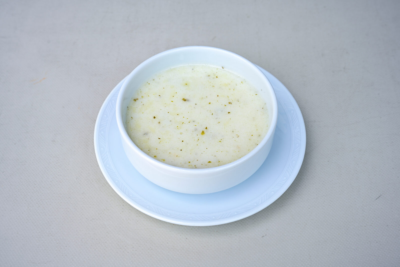 A warm bowl of garlic yogurt soup, lightly spiced and comforting, which makes it perfect to begin your iftar meal. (Adobe Stock Photo)