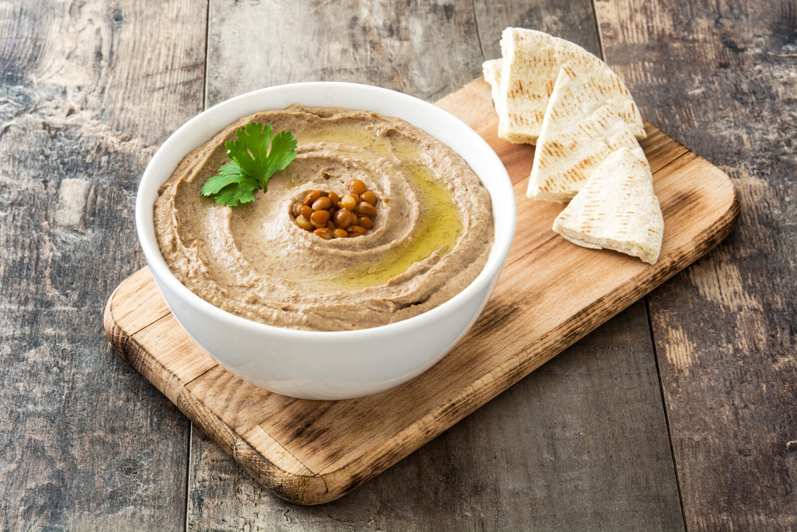 A bold and flavorful red lentil dip, blended with olive oil and spices, perfect as an appetizer for an iftar meal during Ramadan 2025. (Adobe Stock Photo)