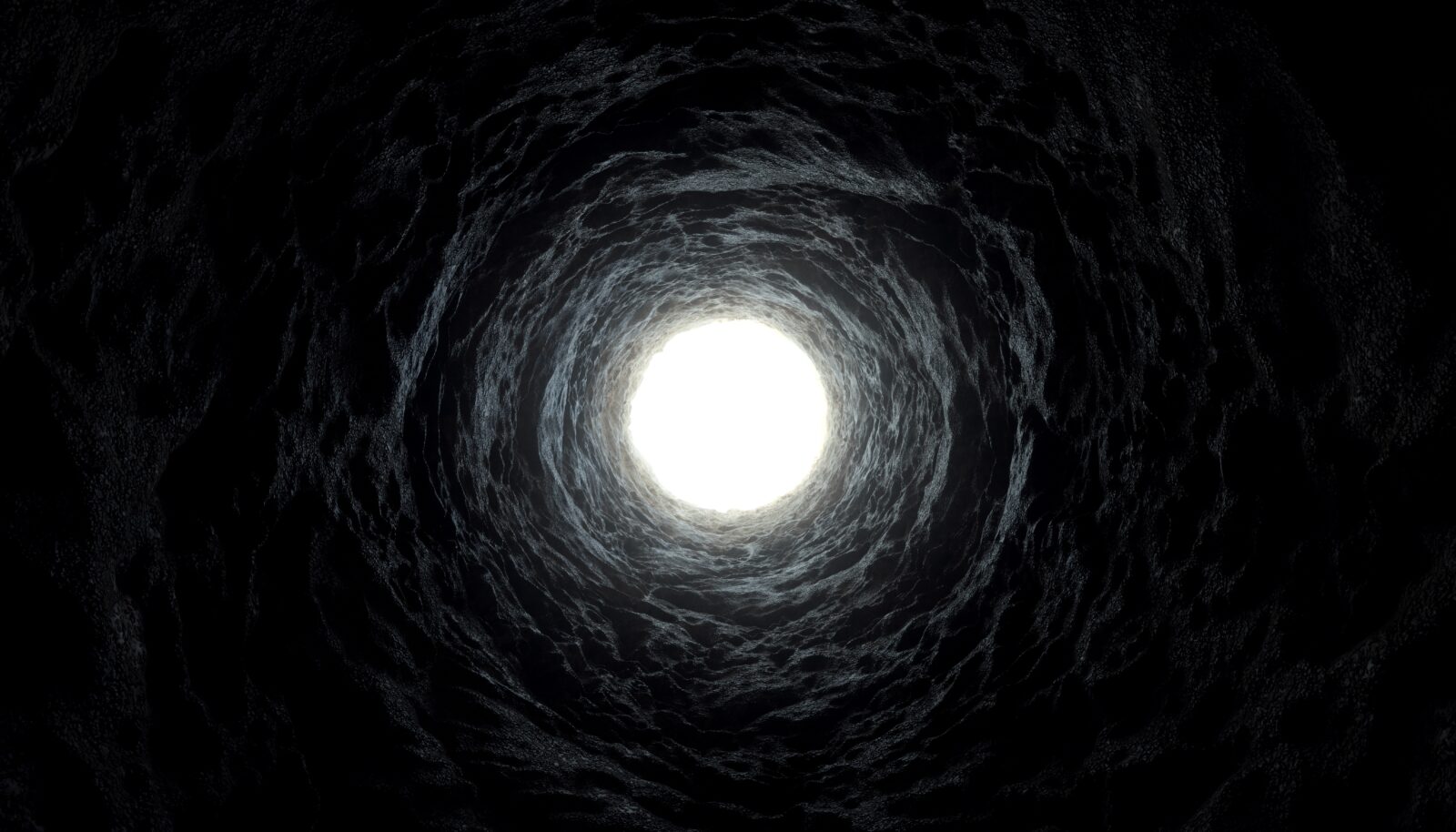 A mysterious tunnel with a glowing exit, evoking the concept of black holes, wormholes, and the mysteries of the universe. (Adobe Stock Photo)