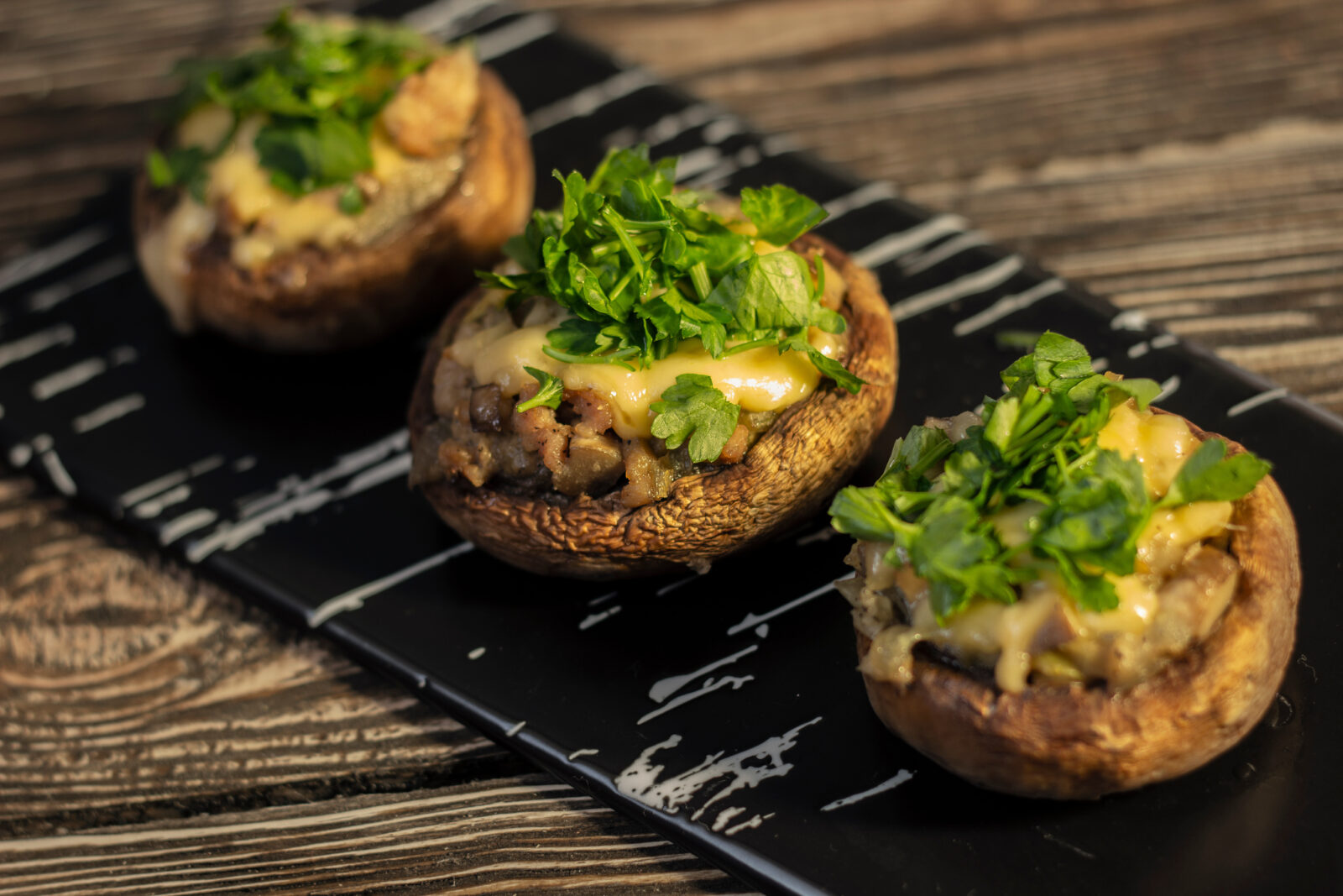 Stuffed mushrooms filled with cheese, herbs, and breadcrumbs, perfect as a light iftar appetizer. (Adobe Stock Photo)