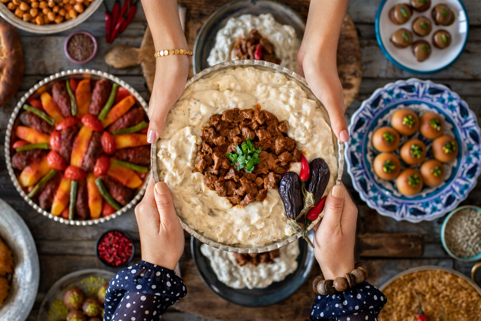 A rich and creamy Turkish dish, Hunkar Begendi, featuring slow-cooked lamb stew over smoky eggplant puree, the star of today's iftar menu. (Αdobe Stock Photo)