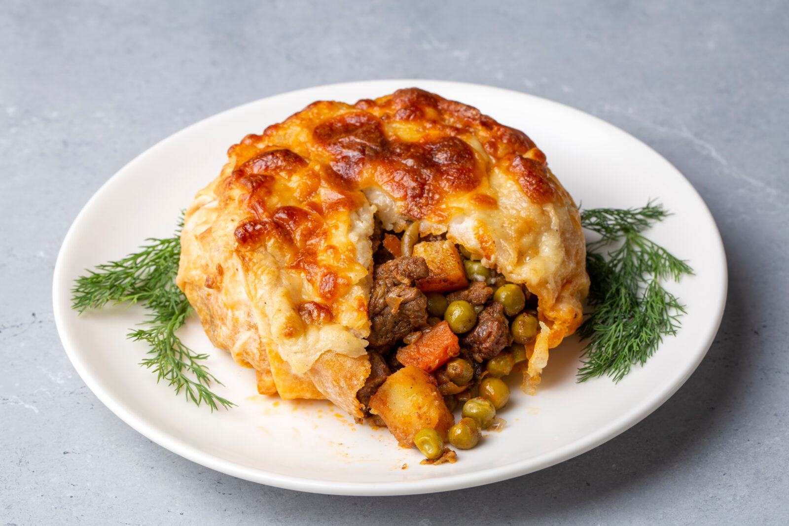 A serving of Turkish bohca kebabi, a savory stuffed pastry filled with tender meat and vegetables. (Adobe Stock Photo)