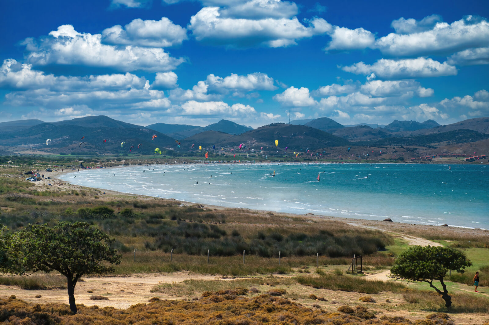 Kite surfers ride the waves at one of Gokceada’s most popular windy beaches, Canakkale, Türkiye. (Adobe Stock Photo)