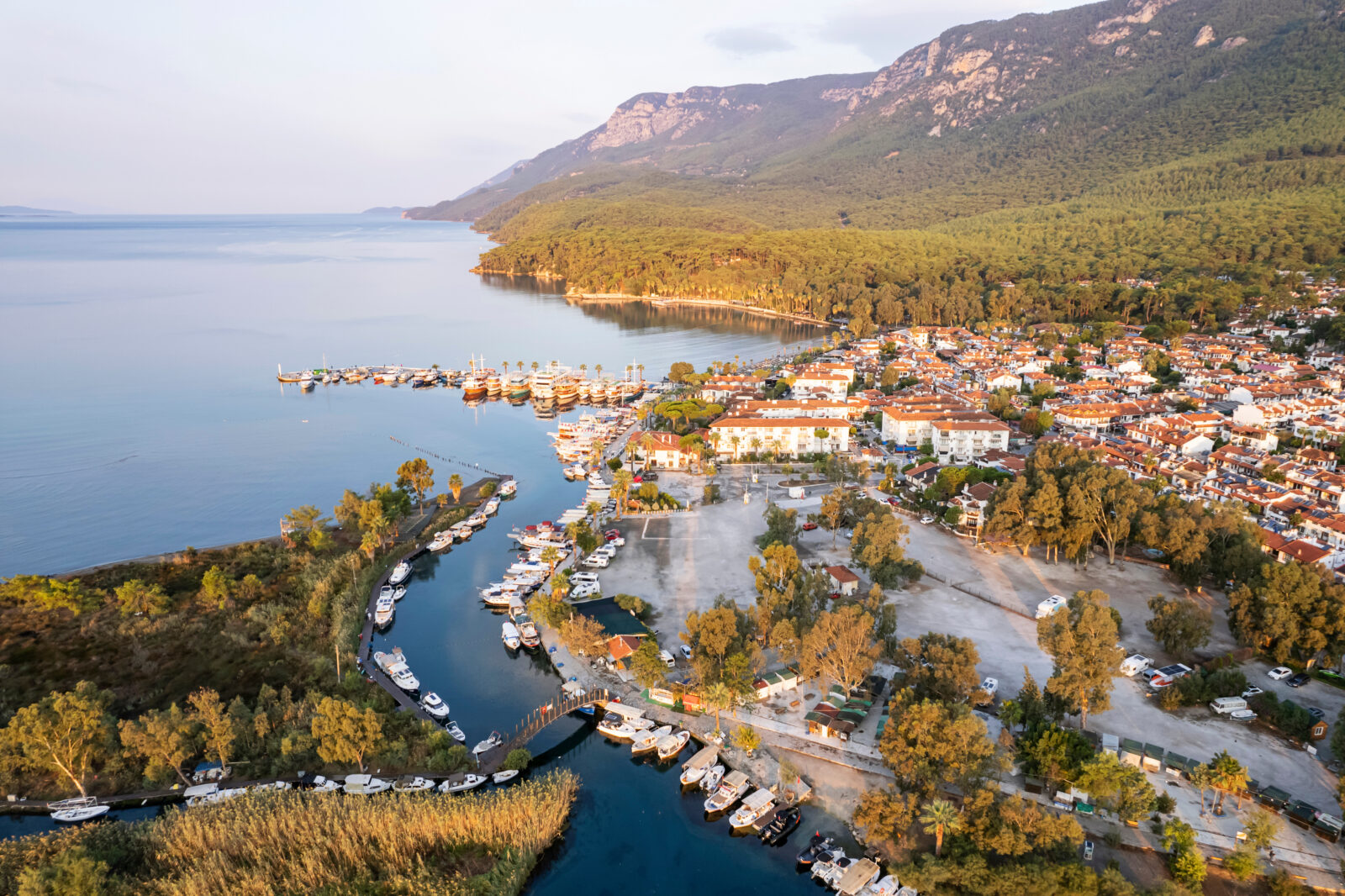 Akyaka’s marina sits where the Azmak River meets the Gulf of Gokova, surrounded by forests, Mugla, Türkiye. (Adobe Stock Photo)