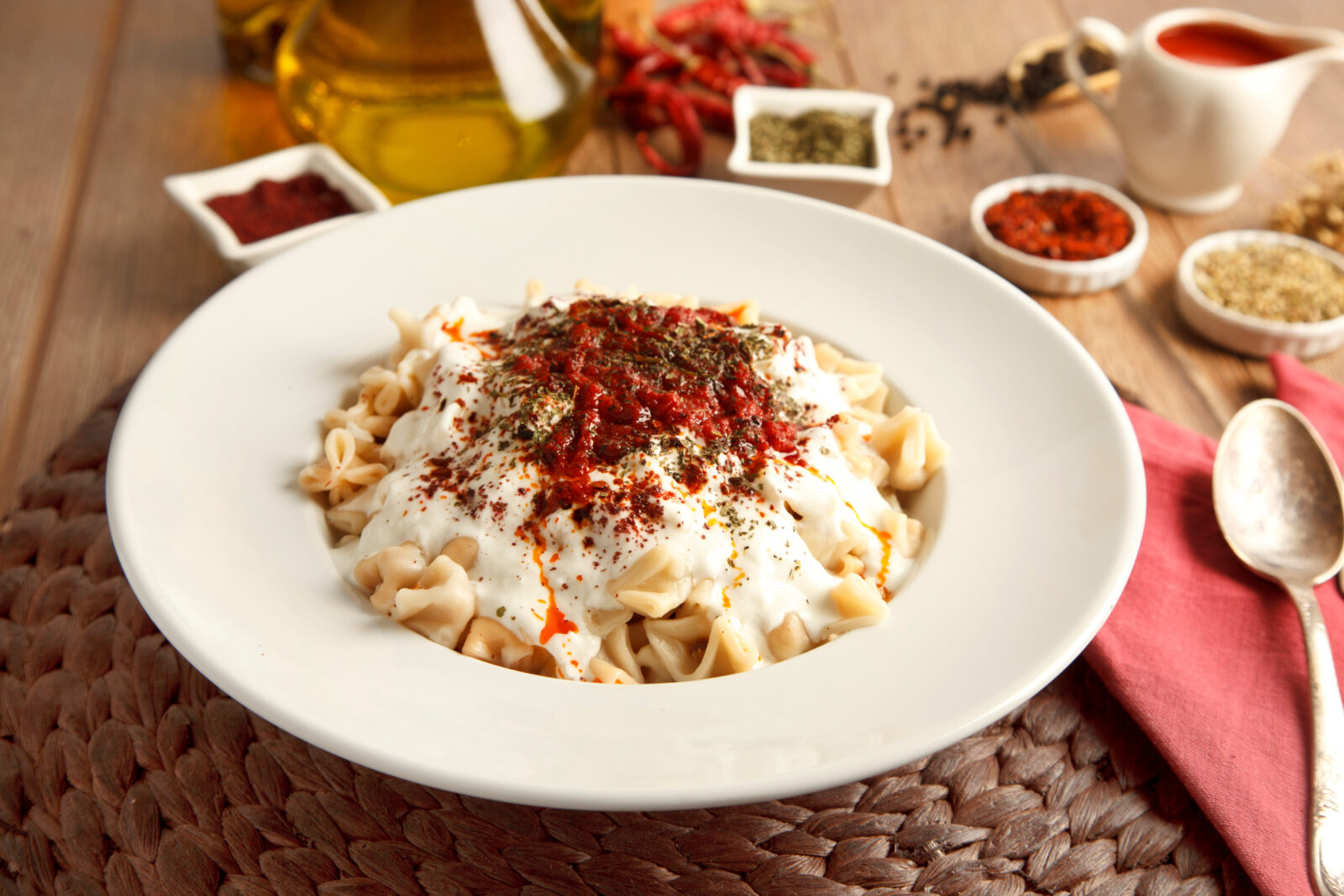 Traditional Turkish manti dumplings are served with garlic yogurt, butter, and spices, making for a satisfying iftar meal. (Adobe Stock Photo)