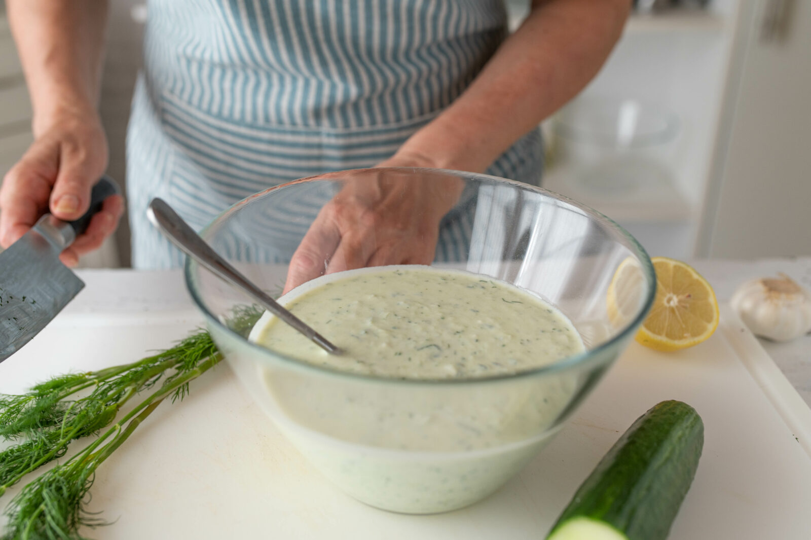 A fresh bowl of haydari, a creamy yogurt dip with cucumber and dill, being prepared for a refreshing start to iftar. (Adobe Stock Photo)