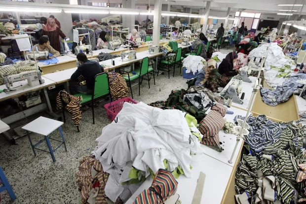 Workers at a clothing factory sew garments amid piles of fabric in Port Said, Egypt, accessed on March 18, 2025. (AFP Photo)