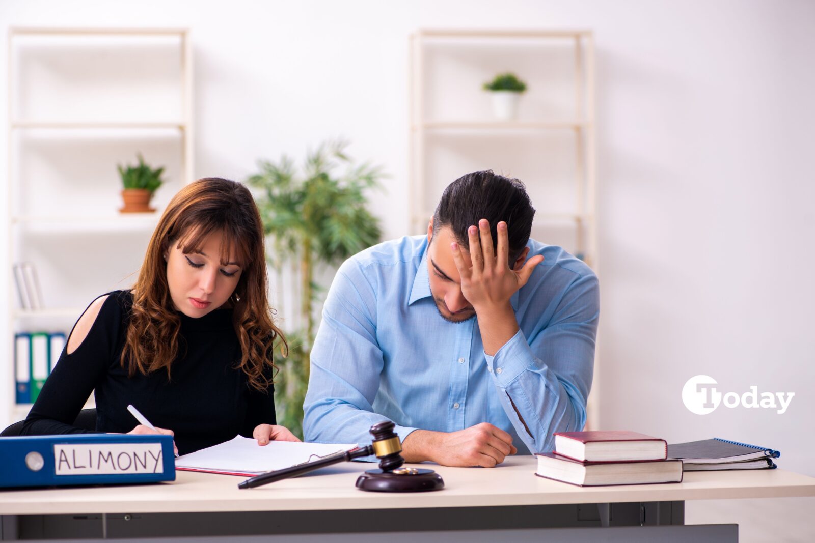 A couple preparing for divorce next to the alimony file. March 5, 2025. (Adobe Stock Photo)