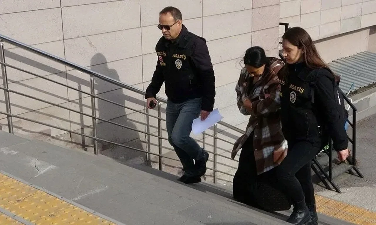 Police officers escort Ceylan Cicek to court following her arrest in Istanbul, Türkiye, Mar. 16, 2025. (TGRT Photo)