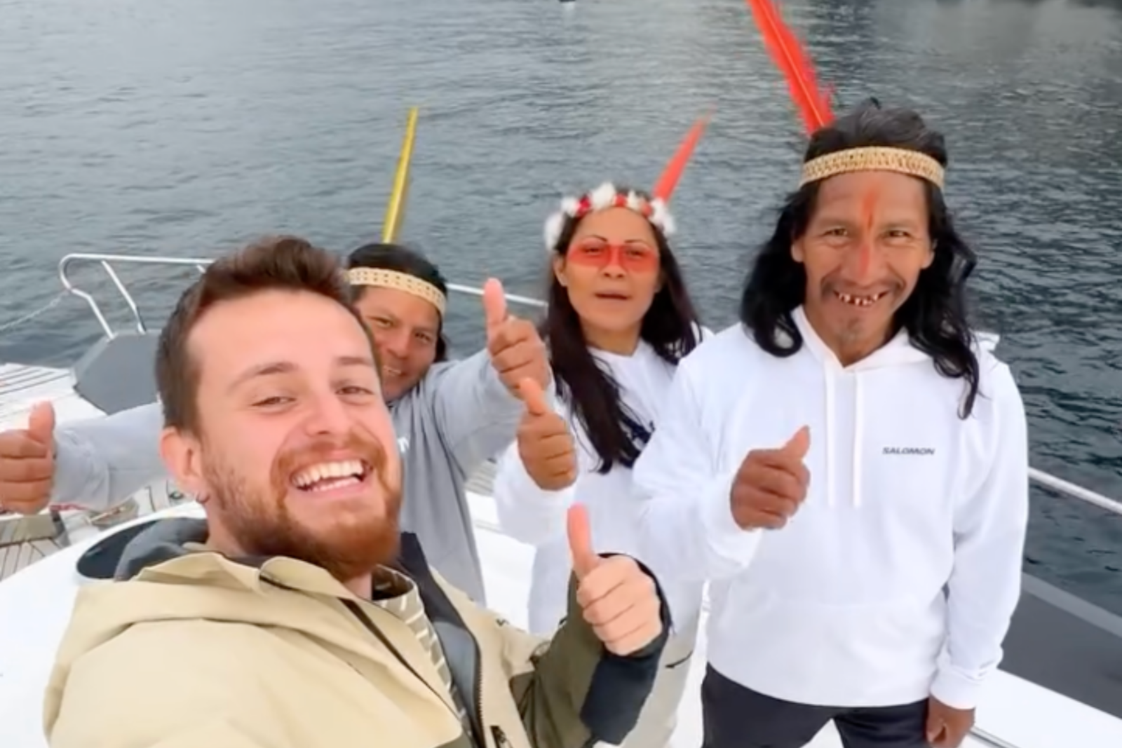 Turkish influencer Alper Rende and Waorani visitors celebrate their journey in Türkiye with a joyful thumbs-up on a boat in Istanbul, Türkiye, Feb. 4, 2025. (Photo via Instagram / @alperrende)