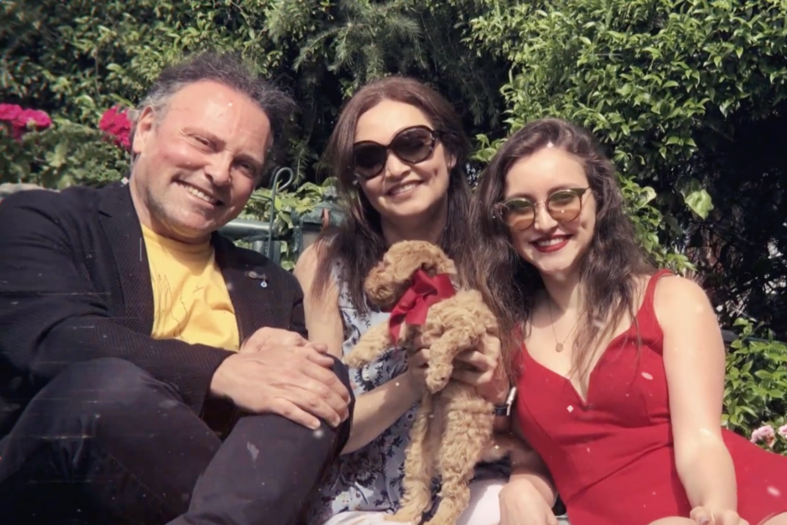 Ilayda Samilgil with her parents and their dog, enjoying a moment outdoors. (Photo via YouTube)