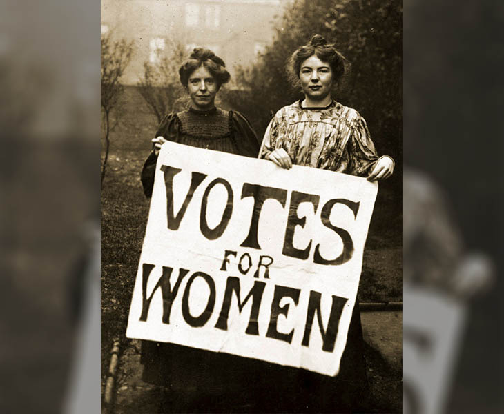Women’s suffrage activists in the early 1900s hold a ‘Votes for Women’ sign, demanding political rights during the fight for gender equality, New York, United States, 1908. (Photo via IWD)