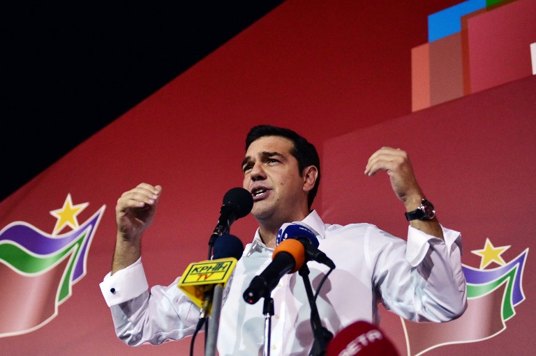 Syriza leader Alexis Tsipras speaks with supporters after his party's victory in the Greek general elections at his campaign headquarters in Athens on September 20, 2015. With over half of the votes counted, Tsipras' Syriza party won 35.54 percent of the vote against 28.07 percent for conservative New Democracy and will form a coalition government with the nationalist Independent Greeks party. AFP PHOTO/ LOUISA GOULIAMAKI