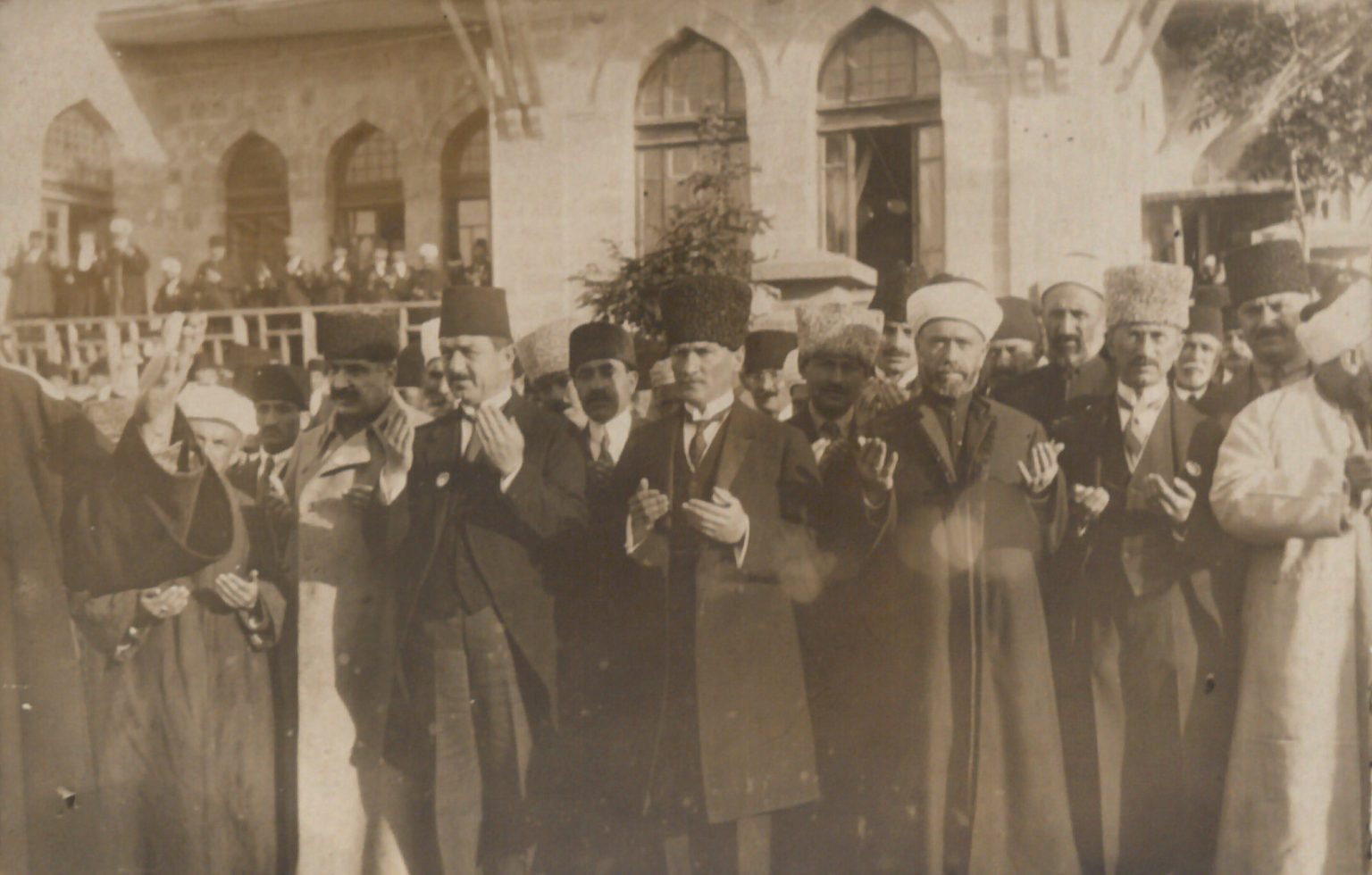 The photo shows a prayer led by Abdullah Azmi Efendi in front of the First Grand National Assembly building on Istasyon Street for the victory of the Turkish army during the Eid al-Fitr celebration, with Mustafa Kemal in attendance, Ankara, Türkiye, May 28, 1922. (Photo via Koc University)