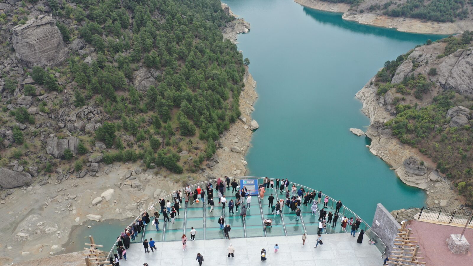An aerial view of the Ali Kayasi Glass Terrace, located on the peak of steep cliffs 160 meters high in the Onikisubat district of Kahramanmaras, welcoming visitors during the Eid al-Fitr in Türkiye, April 1, 2025. (AA Photo)