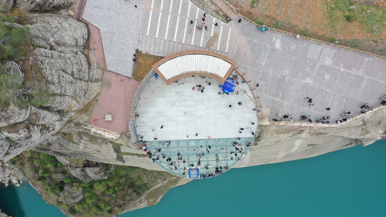 An aerial view of the Ali Kayasi Glass Terrace, located on the peak of steep cliffs 160 meters high in the Onikisubat district of Kahramanmaras, welcoming visitors during the Eid al-Fitr in Türkiye, April 1, 2025. (AA Photo)