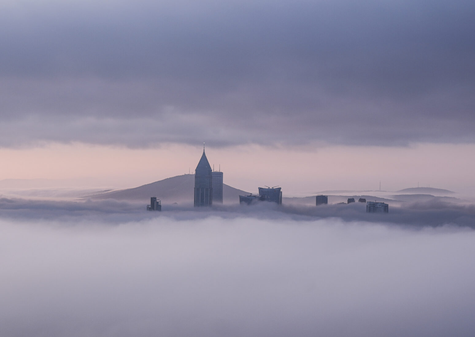 An aerial view of the city as a fog blanket of fog covers the buildings in the Atasehir district of Istanbul, Türkiye, on April 5, 2025. (AA Photo)