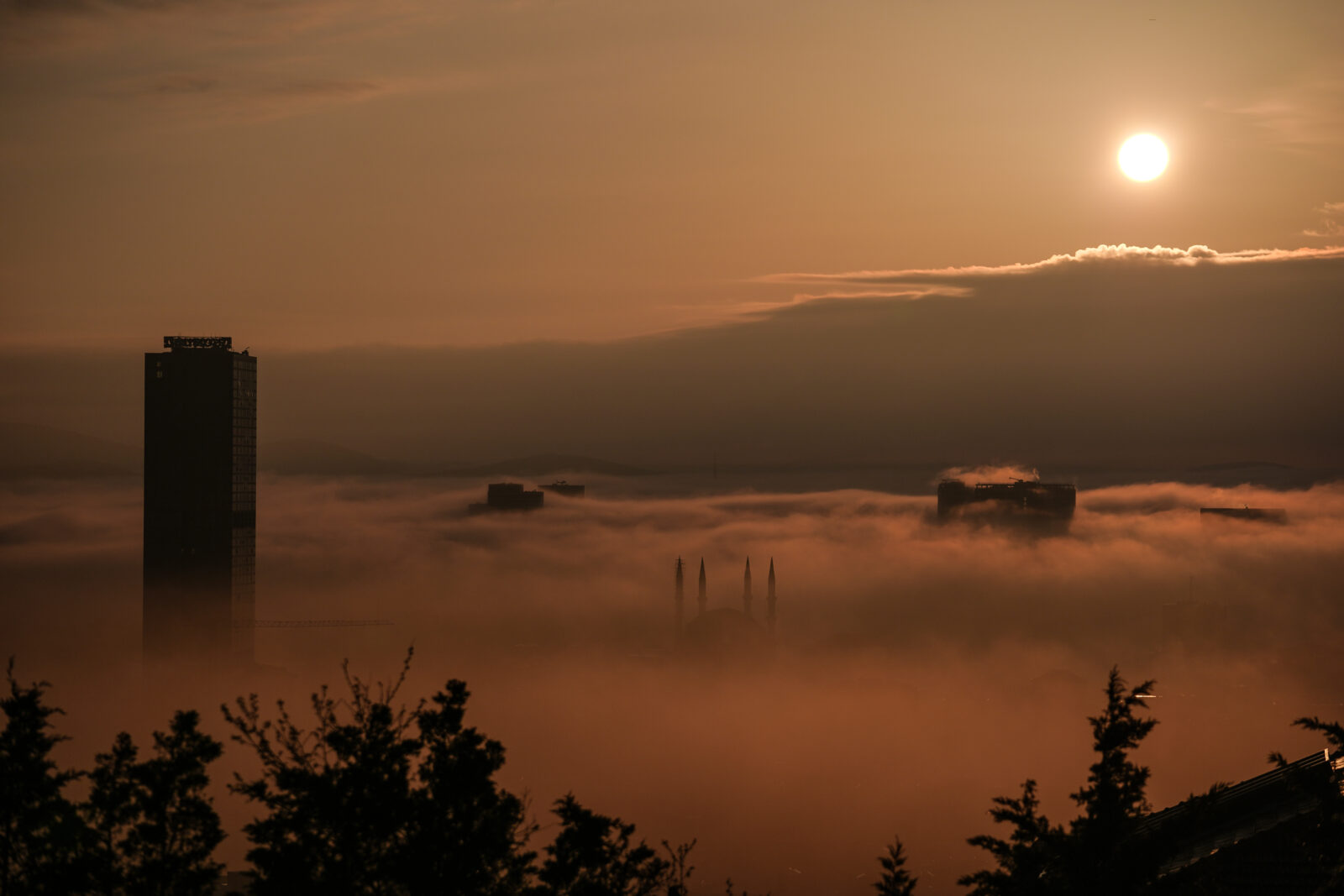An aerial view of the city as a fog blanket of fog covers the buildings in the Umraniye district