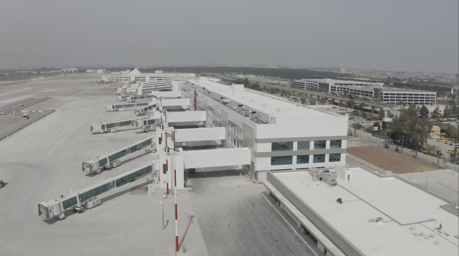 Aerial view of Antalya Airport’s new international terminal, showcasing expanded jet bridges and apron areas in Antalya, Türkiye, on Apr. 6, 2025. (AA Photo)