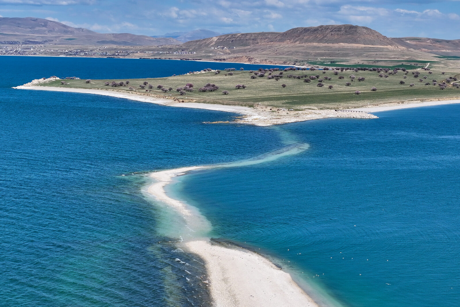 An aerial view shows the ancient road to Carpanak Island in Lake Van, where water loss due to drought and excessive evaporation has caused some historical structures and microbialites, formed over thousands of years, to become visible as a result of shoreline retreat, in Van, Türkiye, April 11, 2025. (AA Photo)
