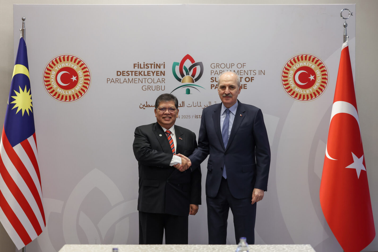 Turkish Parliament Speaker Numan Kurtulmus (R) shakes hands with Speaker of the Malaysian House of Representatives Tan Sri Dato Johari bin Abdul (L) as they pose for a photo prior to their meeting in Istanbul, Türkiye on April 19, 2025. (AA Photo)