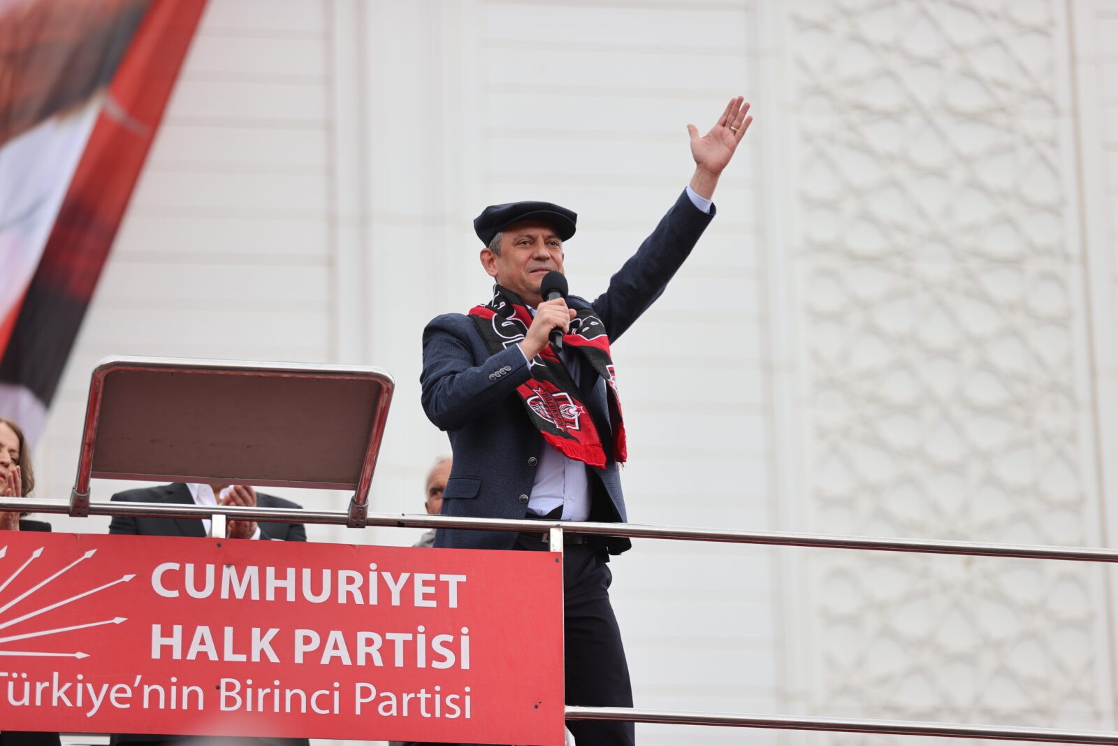 Republican People's Party (CHP) leader Ozgur Ozel addresses supporters from a campaign bus during the 