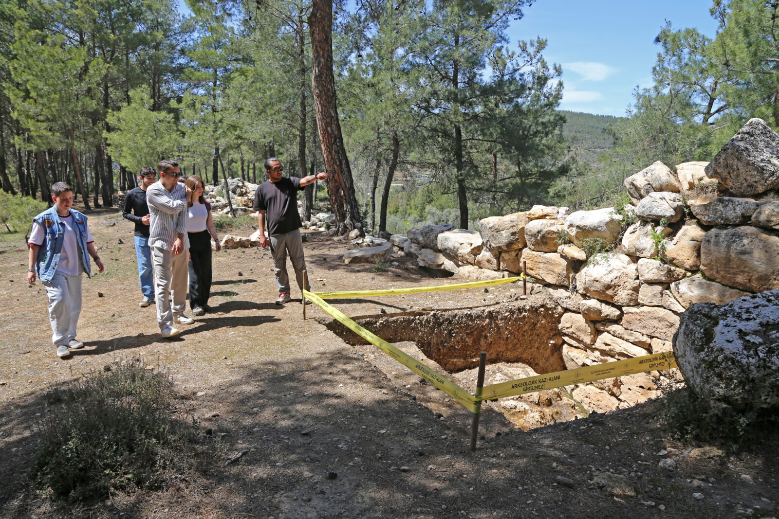 Archaeologists inspect the ancient city walls of Hyllarima in Kavaklidere, Mugla, ahead of planned excavations, April 21, 2025. (AA Photo)