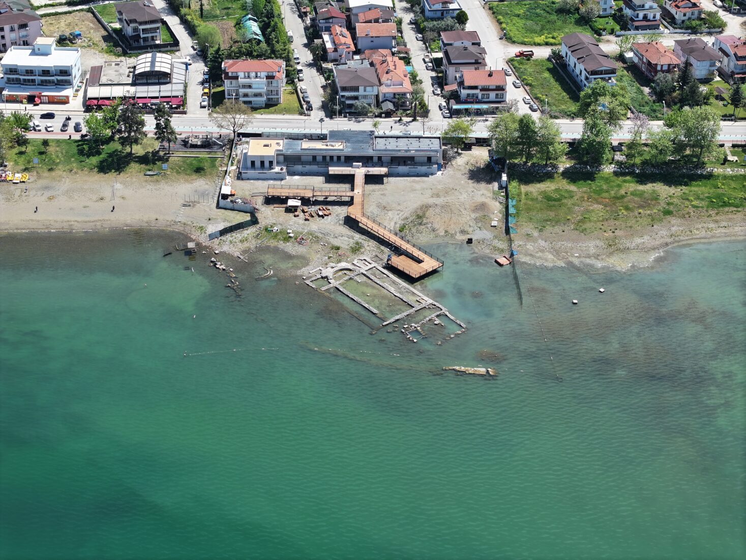 An aerial view of preparations for a planned religious ceremony around the submerged basilica ruins, discovered in 2014 in Lake Iznik, Bursa, Türkiye, believed to have been built in honor of Saint Neophytos, April 22, 2025. (AA Photo)