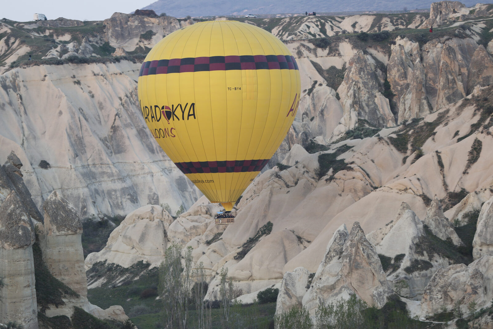 While Cappadocia welcomes millions of tourists every year, hot air balloons with tourists take flight at sunrise, Nevsehir, Türkiye, April 22, 2025. (AA Photo)