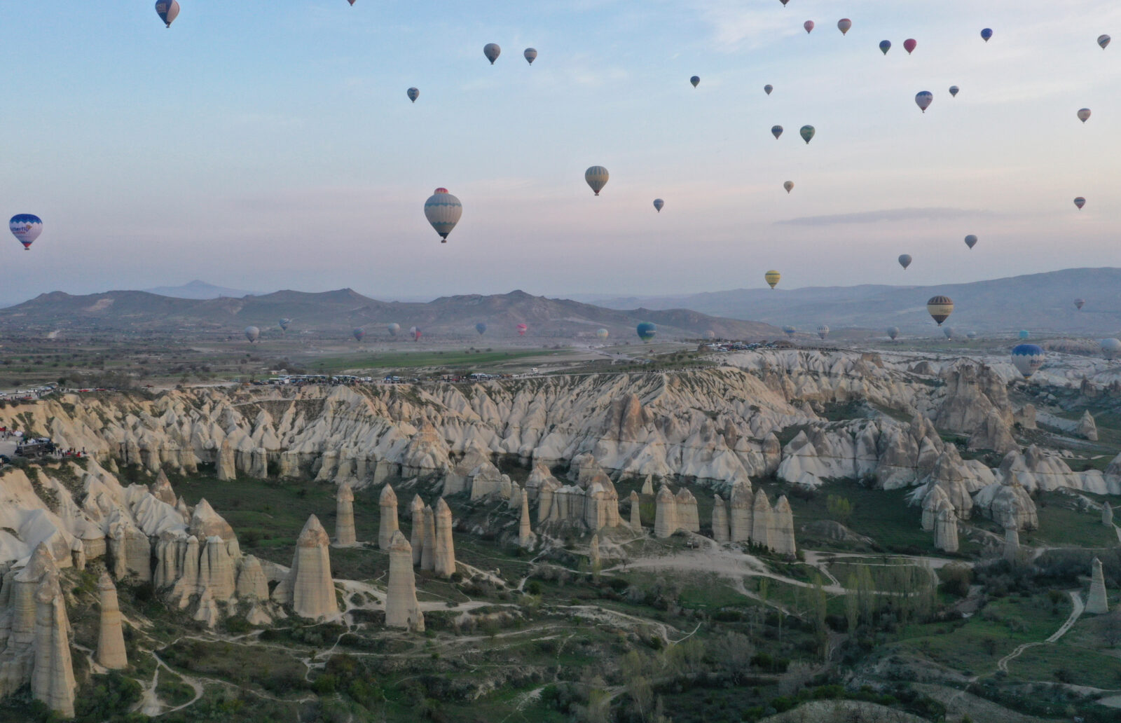 While Cappadocia welcomes millions of tourists every year, hot air balloons with tourists take flight at sunrise, Nevsehir, Türkiye, April 22, 2025. (AA Photo)